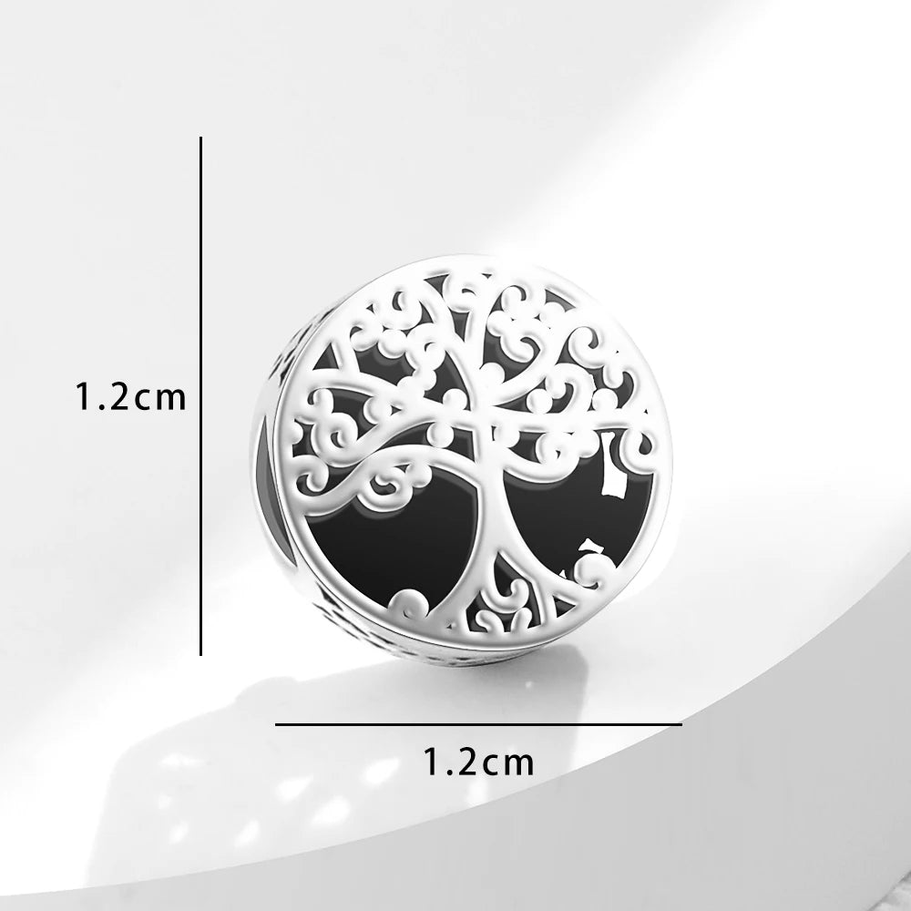 Decorative silver tree of life design on a white background
